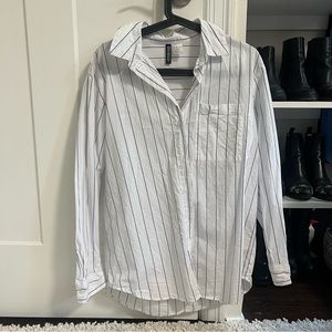 White and black stripped button down shirt divided